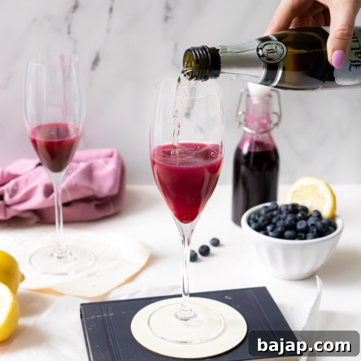 A refreshing Blueberry Mimosa, a bright and lightly sweet spin on the classic cocktail, perfect for Mother's Day, Easter, or wedding showers.