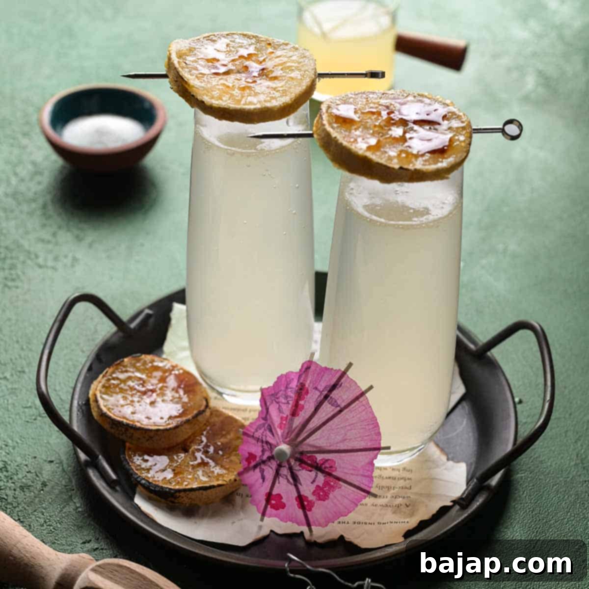 A refreshing lemonade mimosa with an elegant lemon brûlée garnish, offering a zesty twist on a brunch classic.