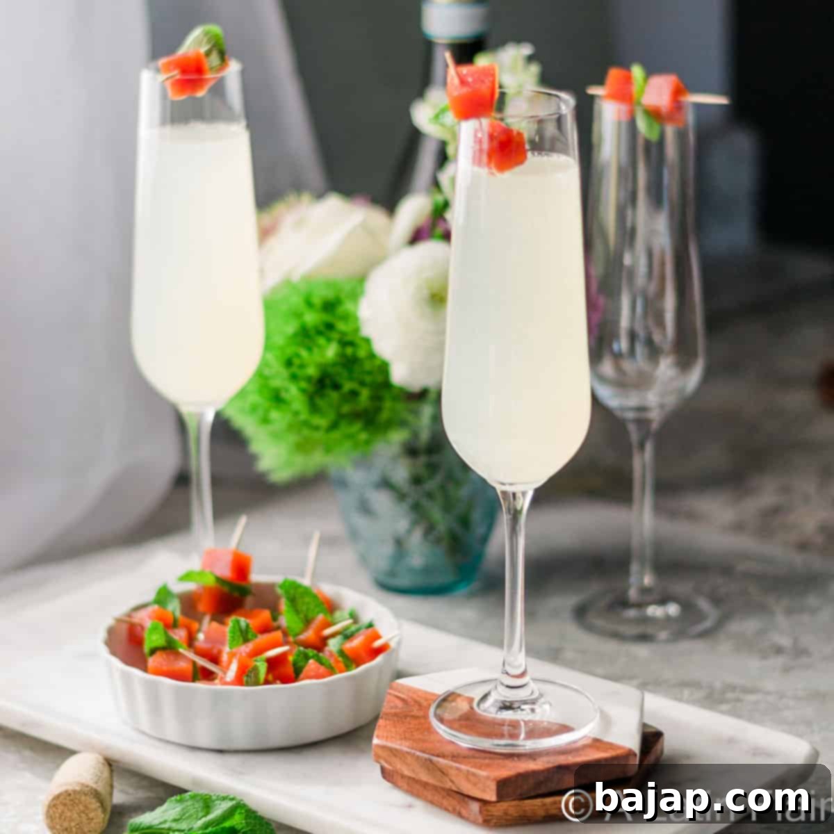 An easy 2-ingredient Guava Mimosa served in a flute glass with guava paste cubes, offering a taste of the tropics.
