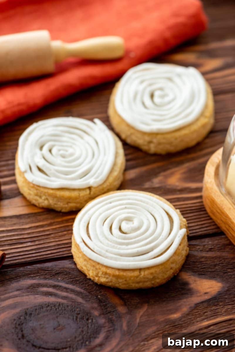 Soft, perfectly sweet Cinnamon Roll Sugar Cookies with cream cheese frosting, a family favorite.