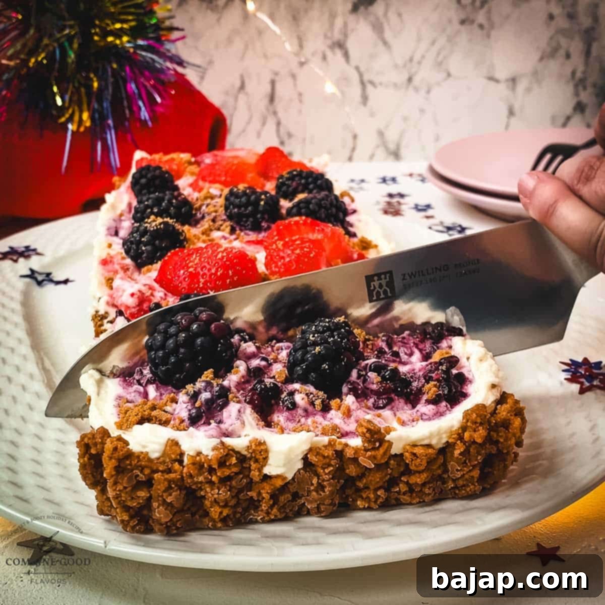 Slice the chilled 4th of July tart into elegant portions, ready for serving.