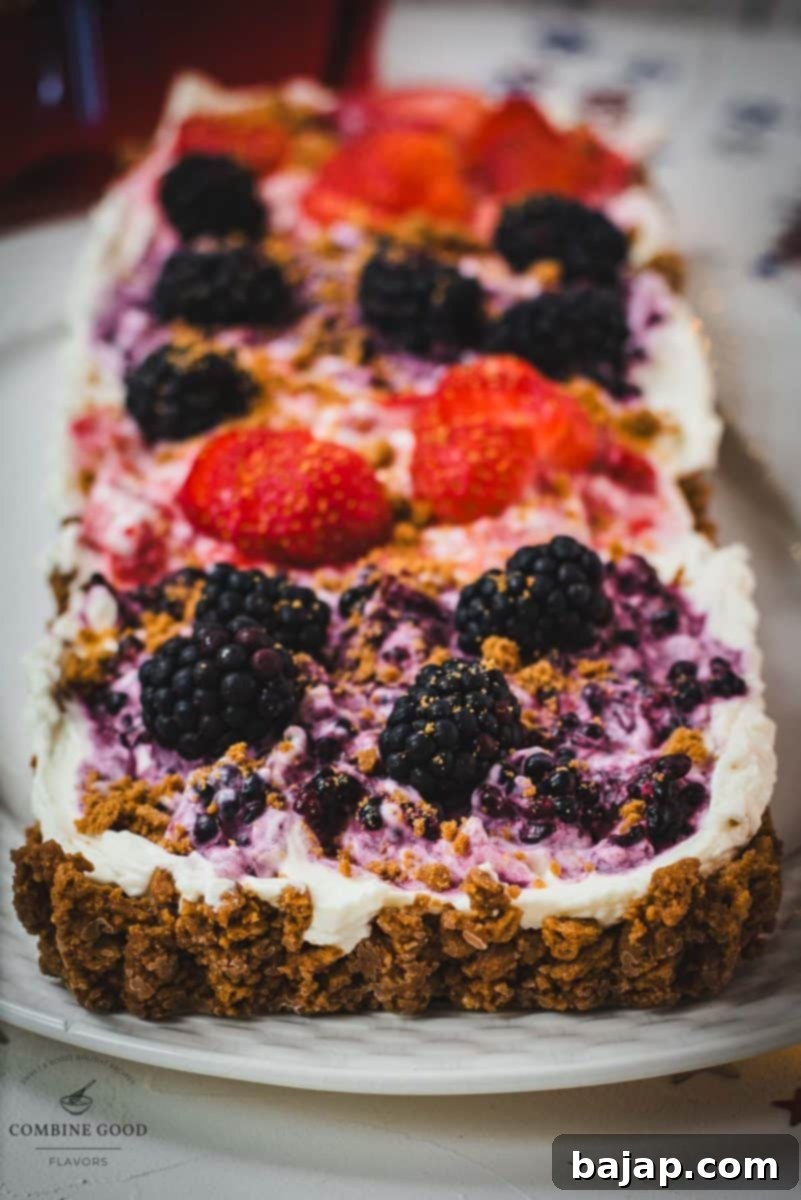 A beautifully decorated 4th of July tart, perfect for summer celebrations, showcasing the vibrant colors and fresh fruit topping.