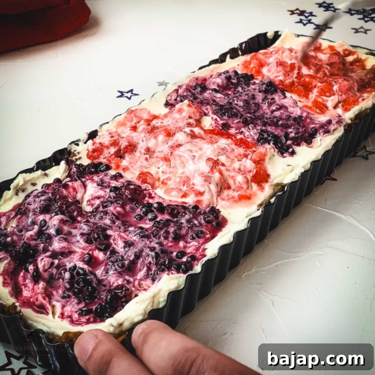 Swirl mashed blackberries alternately into the cream cheese filling, creating a patriotic red, white, and blue design.