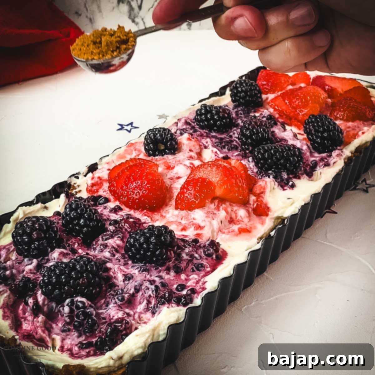 Sprinkle extra Lotus Biscoff cookie crumbs over the 4th of July tart for a finishing touch of flavor and crunch.