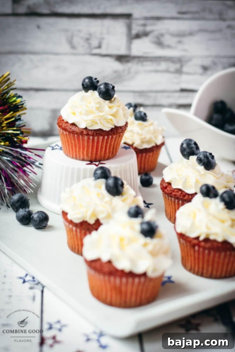 Gorgeous red, white and blue cupcakes, placed on white plate, perfect for 4th of July celebrations.