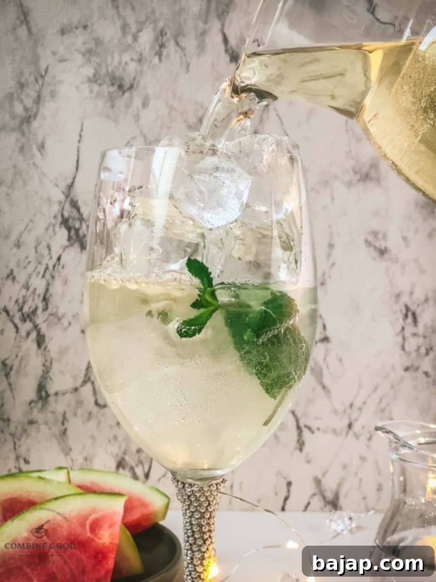 Adding white wine to the wine glass.