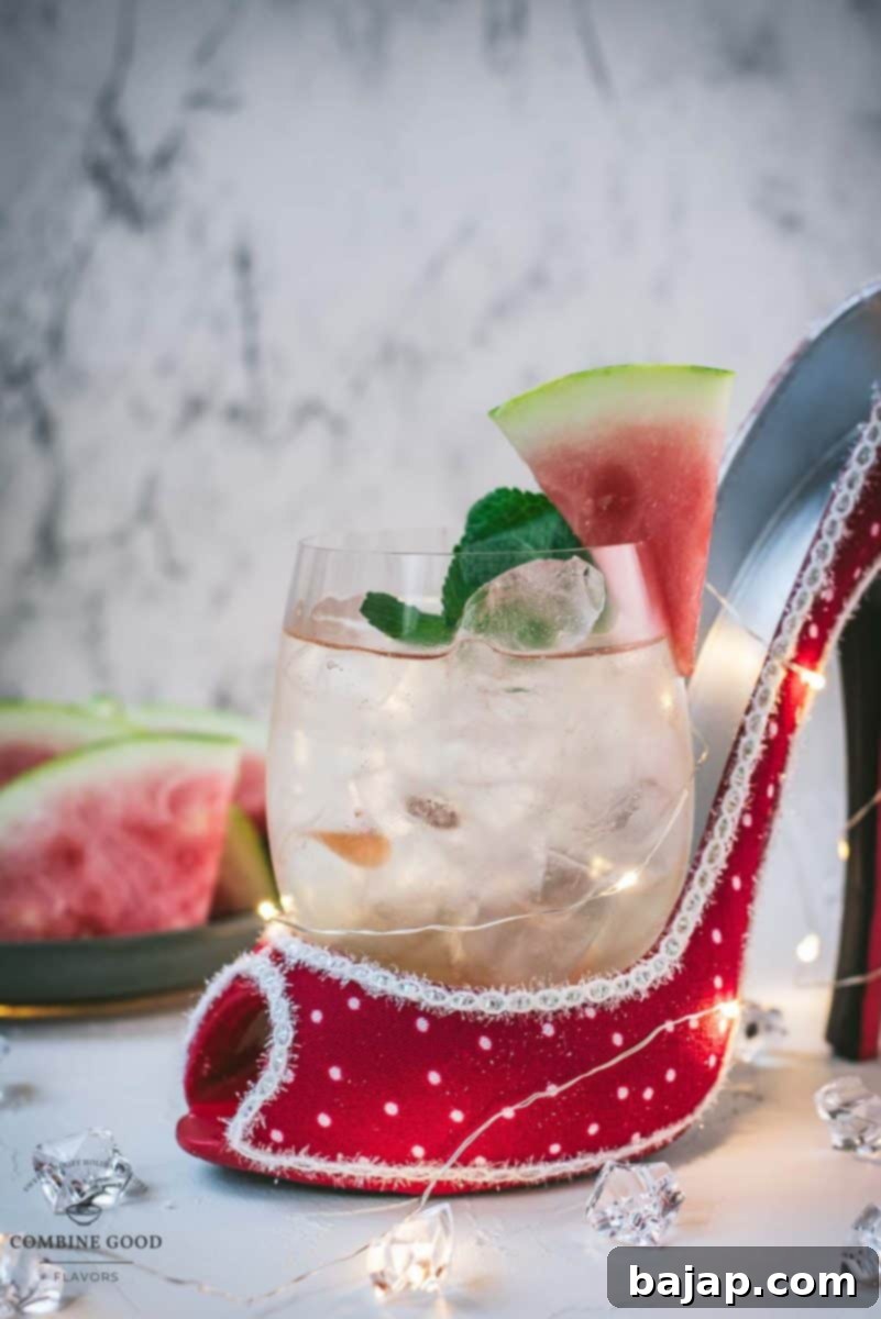 Watermelon Prosecco Spritz 7 An elegantly prepared Prosecco Watermelon Spritz garnished with fresh mint, ready to be enjoyed.