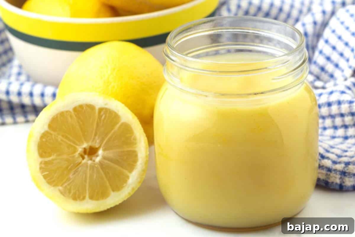 Smooth and creamy easy vegan lemon curd in a glass jar.