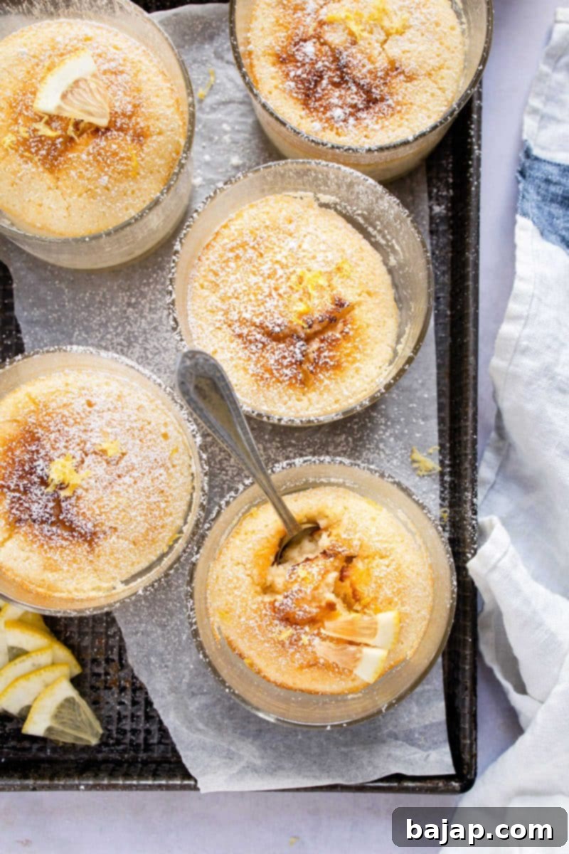 A slice of lemon pudding cake with a distinct pudding layer.