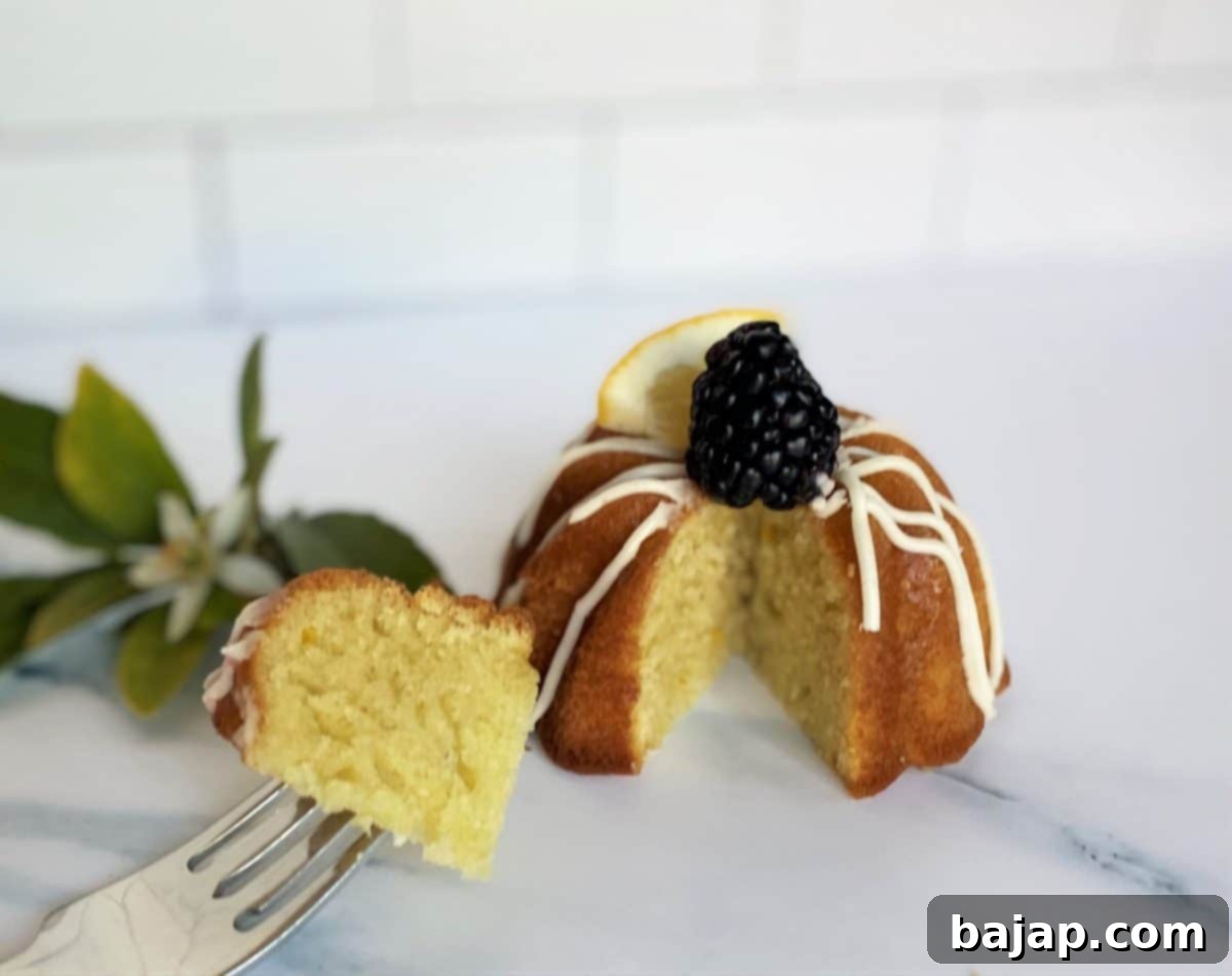 Individual lemon olive oil cakes drizzled with a light lemon glaze.