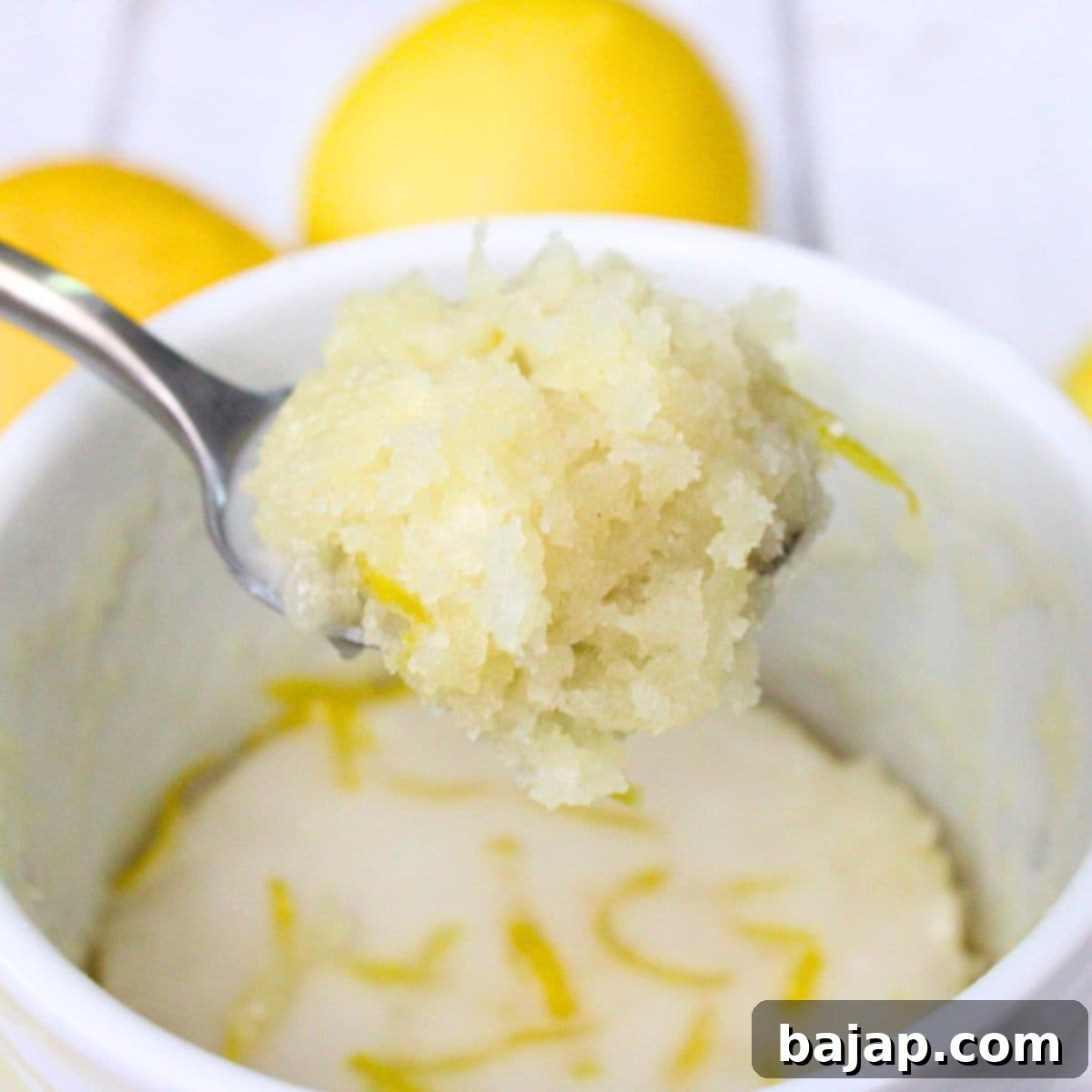 A quick microwave lemon mug cake in a colorful mug.