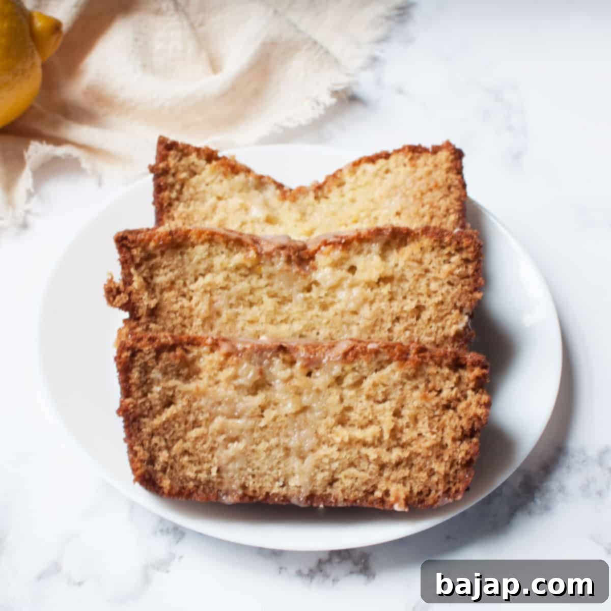A light and airy sourdough lemon loaf with a glaze.