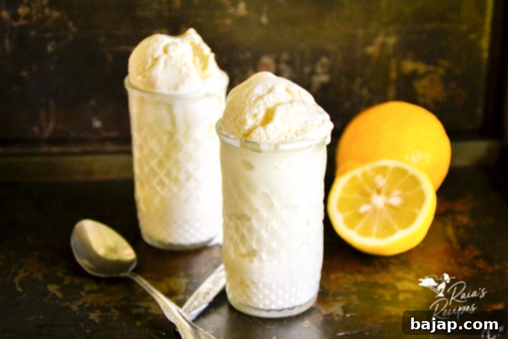 Creamy Lemon Ice Cream in a bowl with fresh lemon slices.
