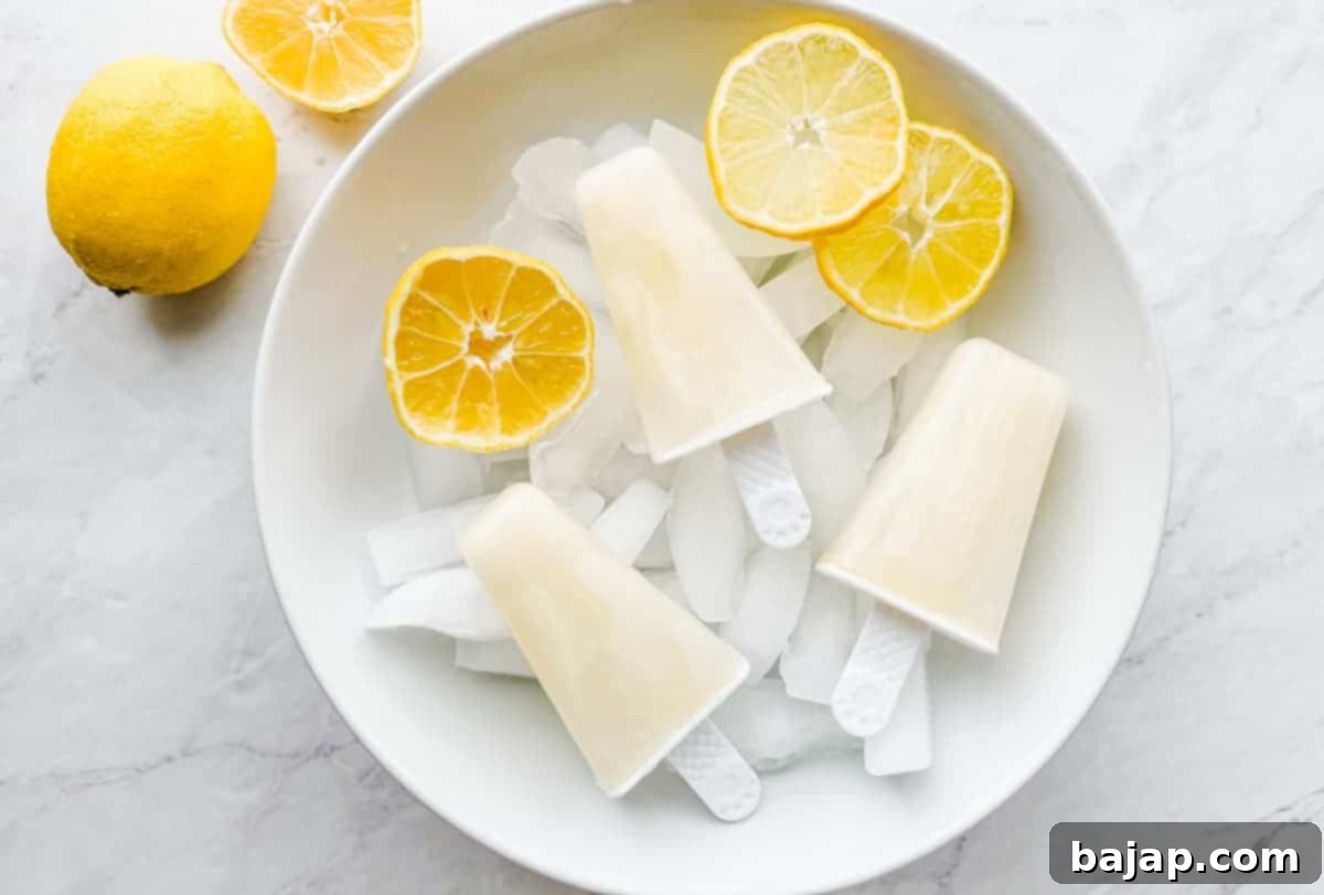 Refreshing 3-ingredient lemon popsicles on a white background.