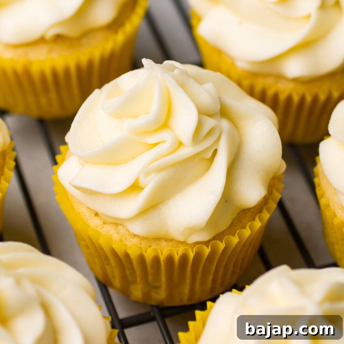 Delicate lemon vanilla cupcakes with creamy frosting.