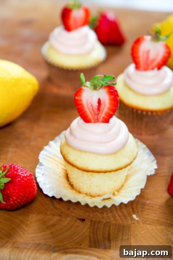 Strawberry lemonade cupcakes with pink buttercream frosting.
