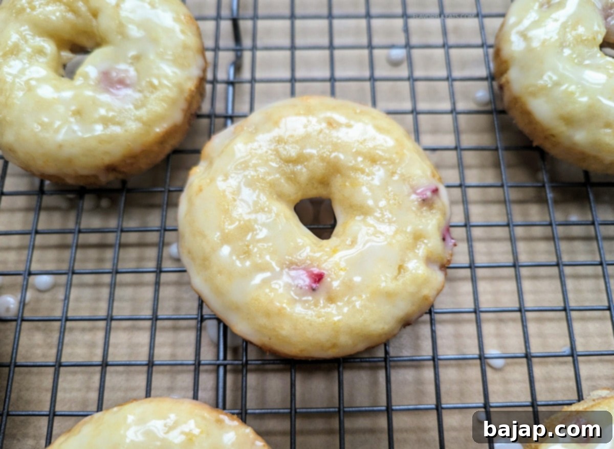 Baked Strawberry Lemon Donuts, topped with a bright lemon glaze.