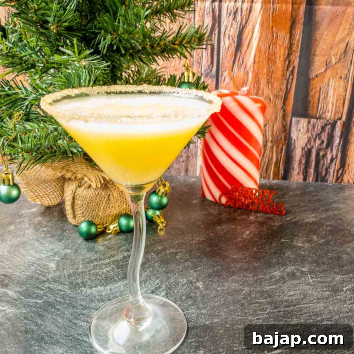 Festive Snowball Cocktail with Bitter Lemon, garnished with a raw cane sugar rim.