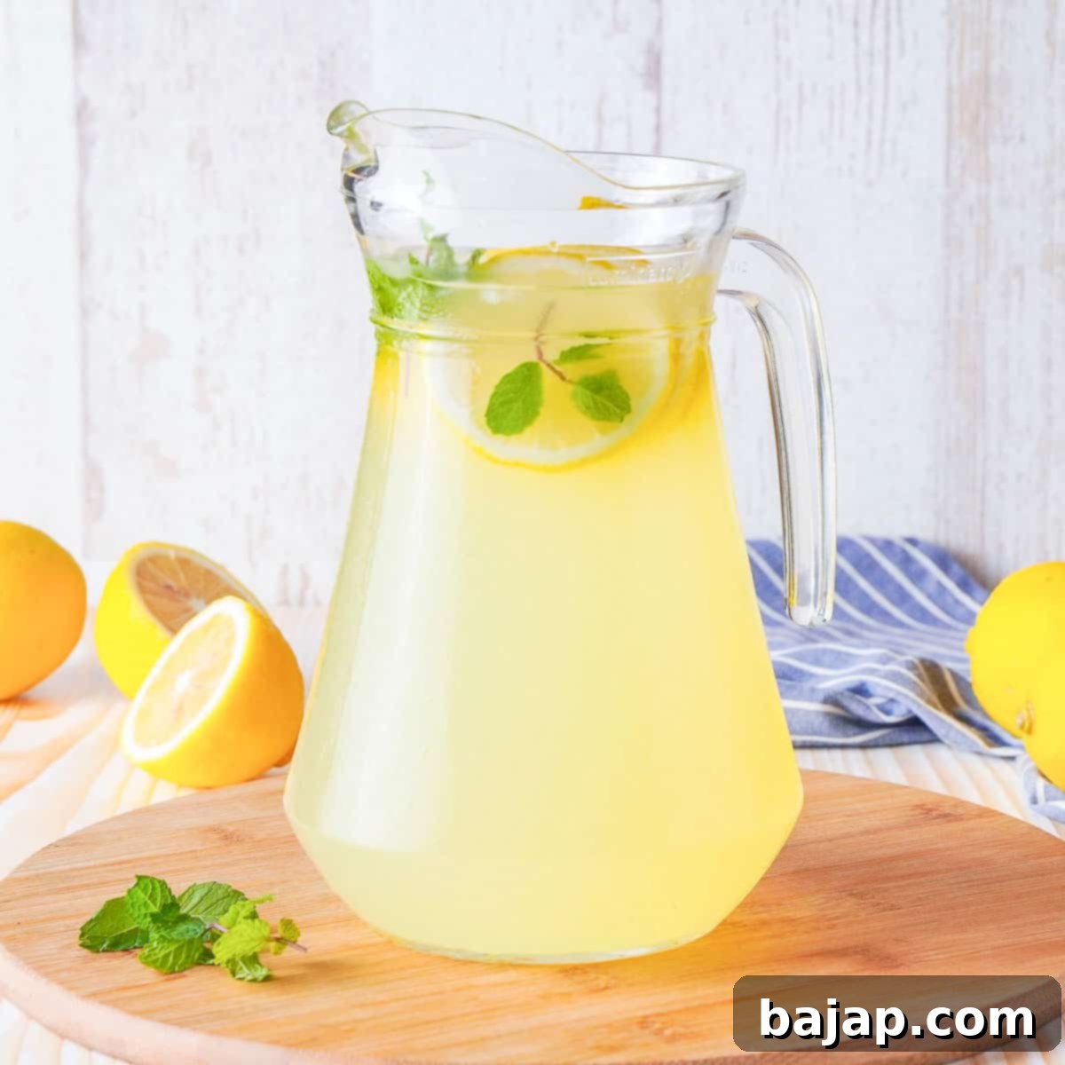 Bright Limoncello Spritz cocktail in a glass with lemon slices.