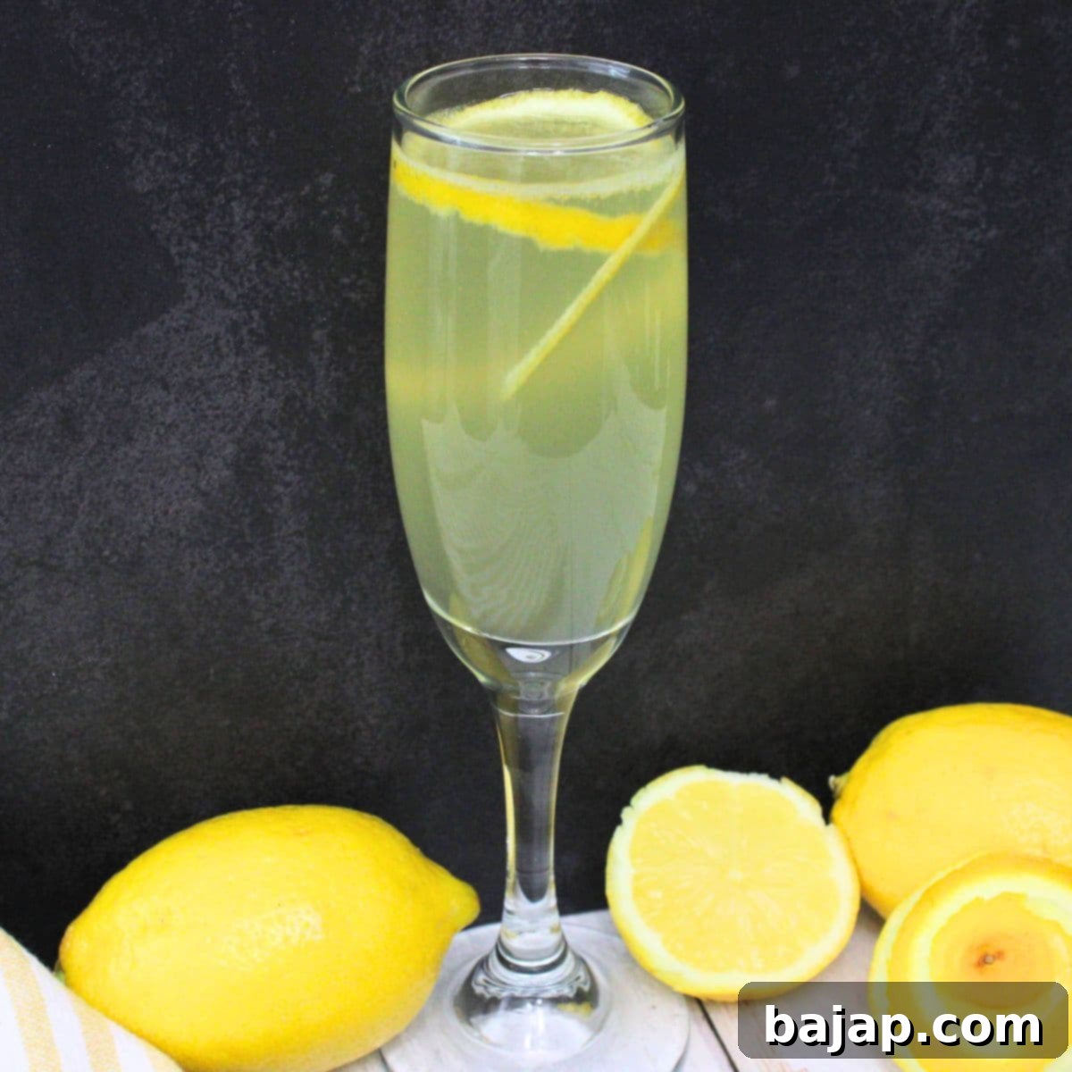 Limoncello French 75 cocktail, a zesty Italian twist on a classic gin drink.