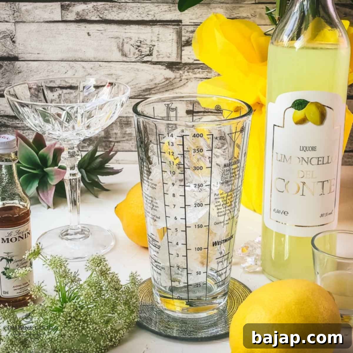 A cocktail shaker filled with sparkling cubed ice, ready for the ingredients. The ice is clear and perfectly formed, hinting at a perfectly chilled drink.