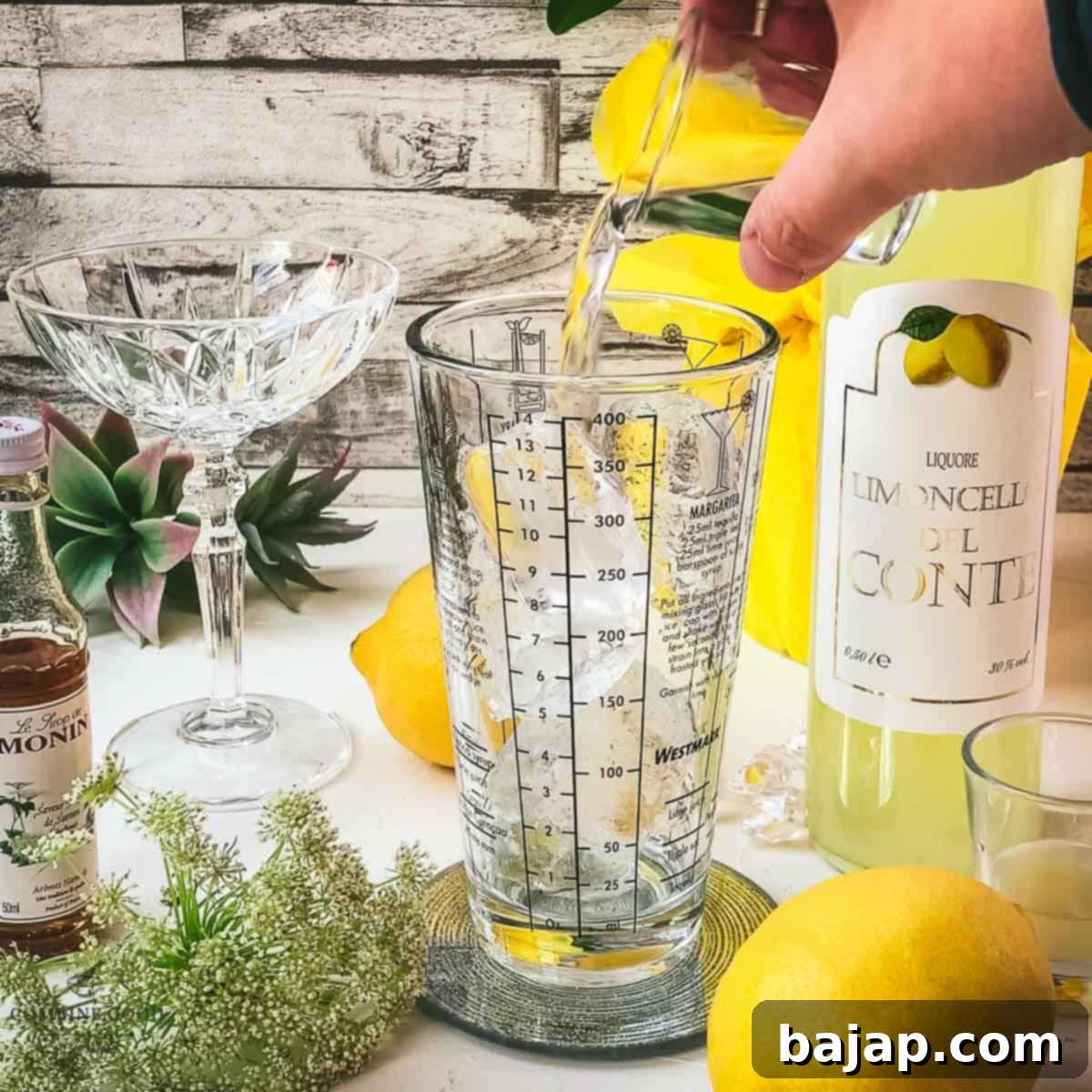 Adding vodka to the cocktail shaker.