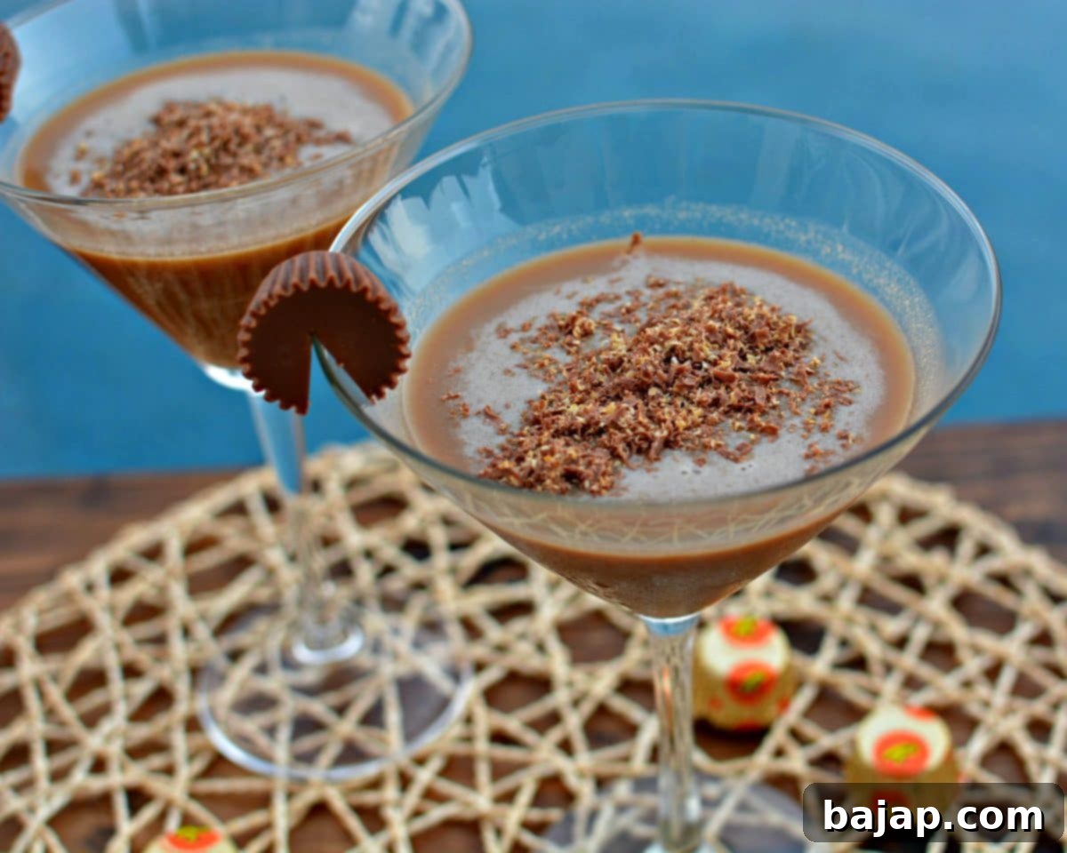 Peanut Butter Cup Martini with chocolate swirl and mini peanut butter cups