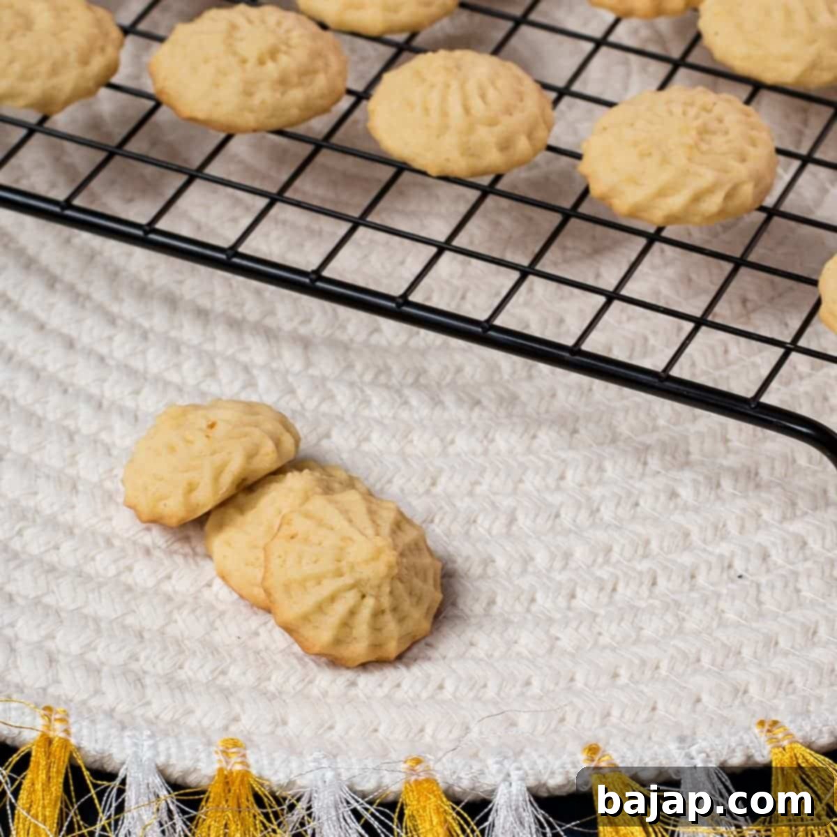 Three gorgeous mini lemon sugar cookies placed next to each other.