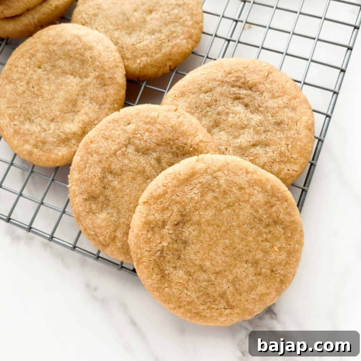 Simple yet delicious 3-ingredient brown sugar cookies on a baking sheet.