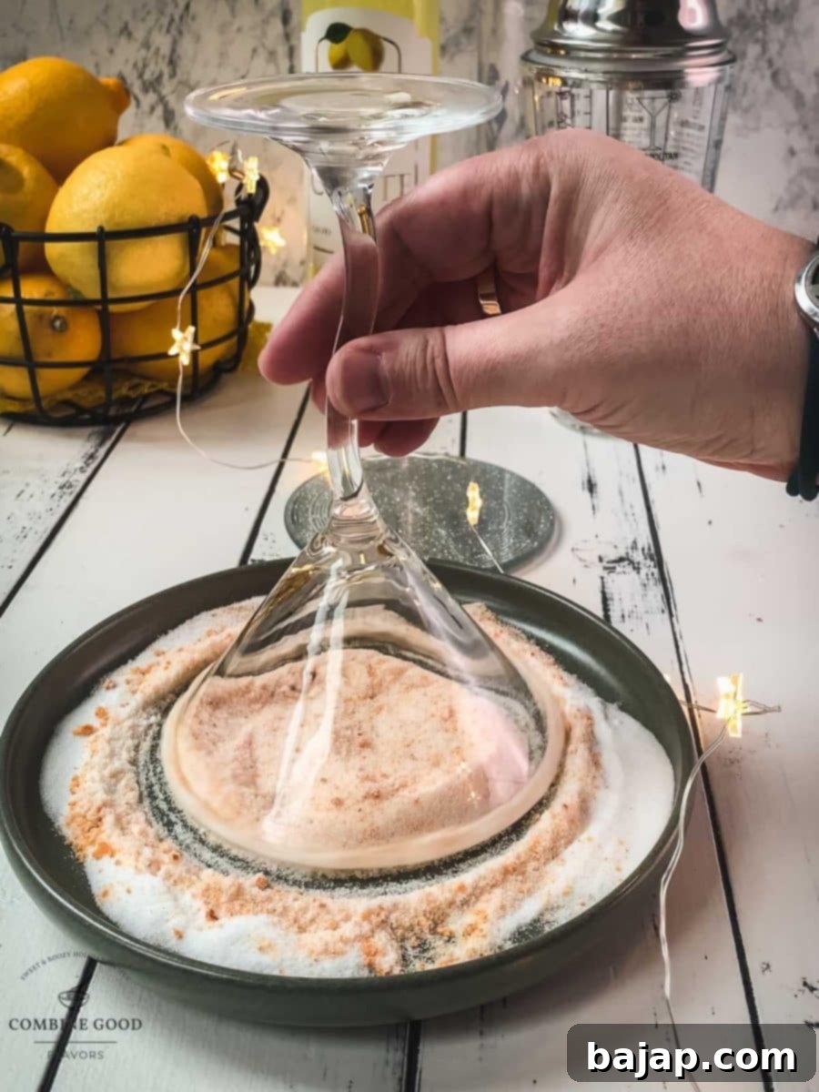 Dip the glass into the orange sugar mix, turning to coat.