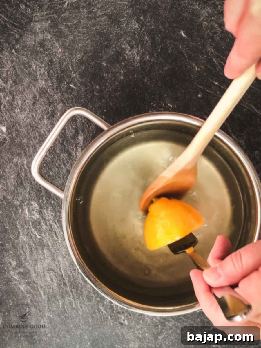 Remove the cooked lemons from the saucepan.