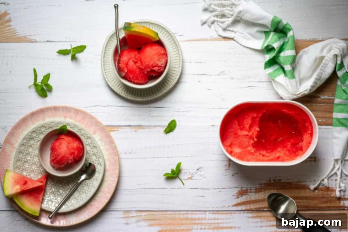 A scoop of vibrant watermelon sorbet with fresh mint, served in a bowl, ready to refresh.