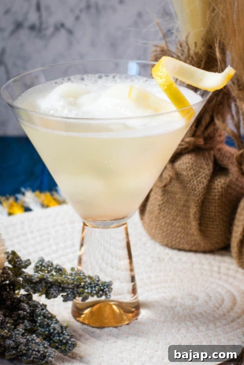 Delicious Sgroppino with homemade lemon sorbet, served in gorgeous glas and garnished with lemon twist, perfect for summer.