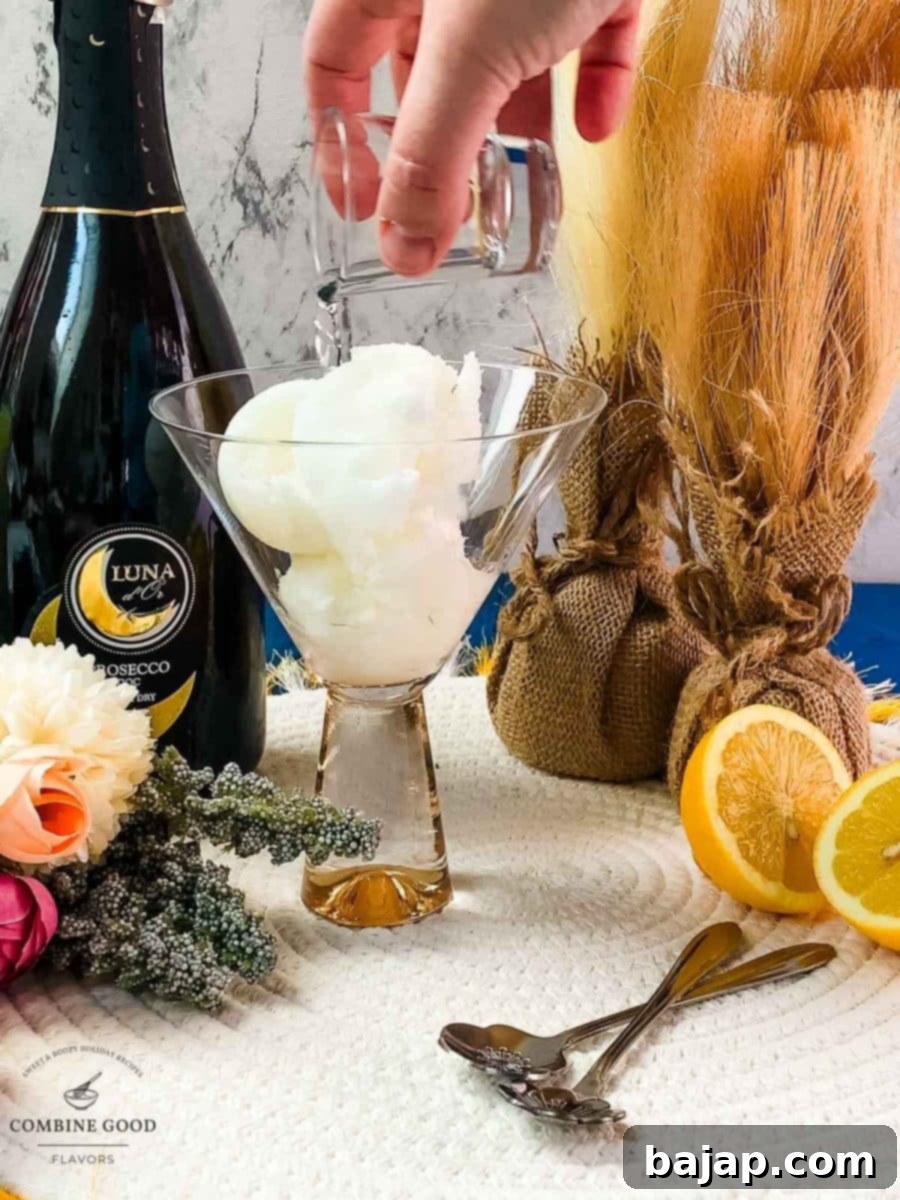 Adding vodka to homemade lemon sorbet in a serving glass for Sgroppino cocktail.