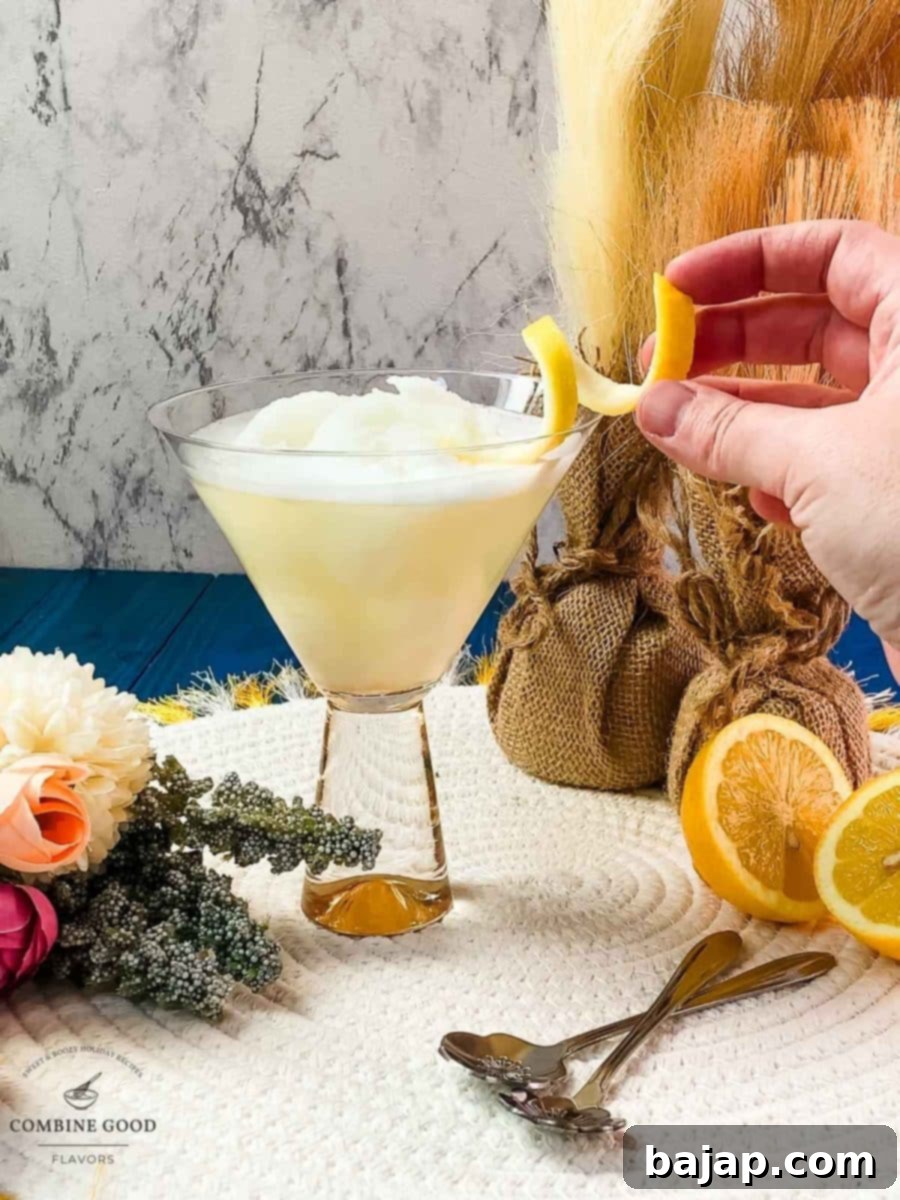 Garnishing the Sgroppino with a perfect lemon twist for an elegant presentation.