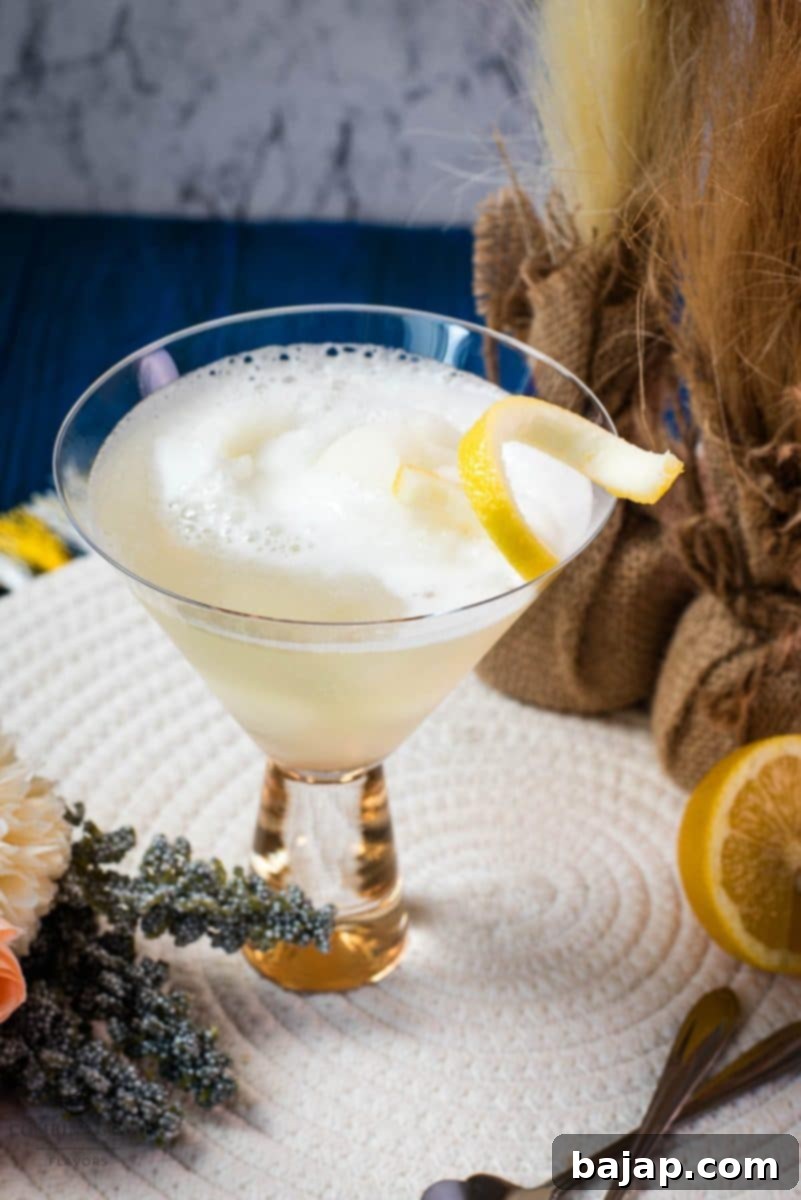 Beautifully prepared Sgroppino with homemade lemon sorbet, elegantly served in a glass and garnished with a lemon twist.
