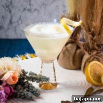 Delicious Sgroppino with homemade lemon sorbet, served in gorgeous glas and garnished with lemon twist.
