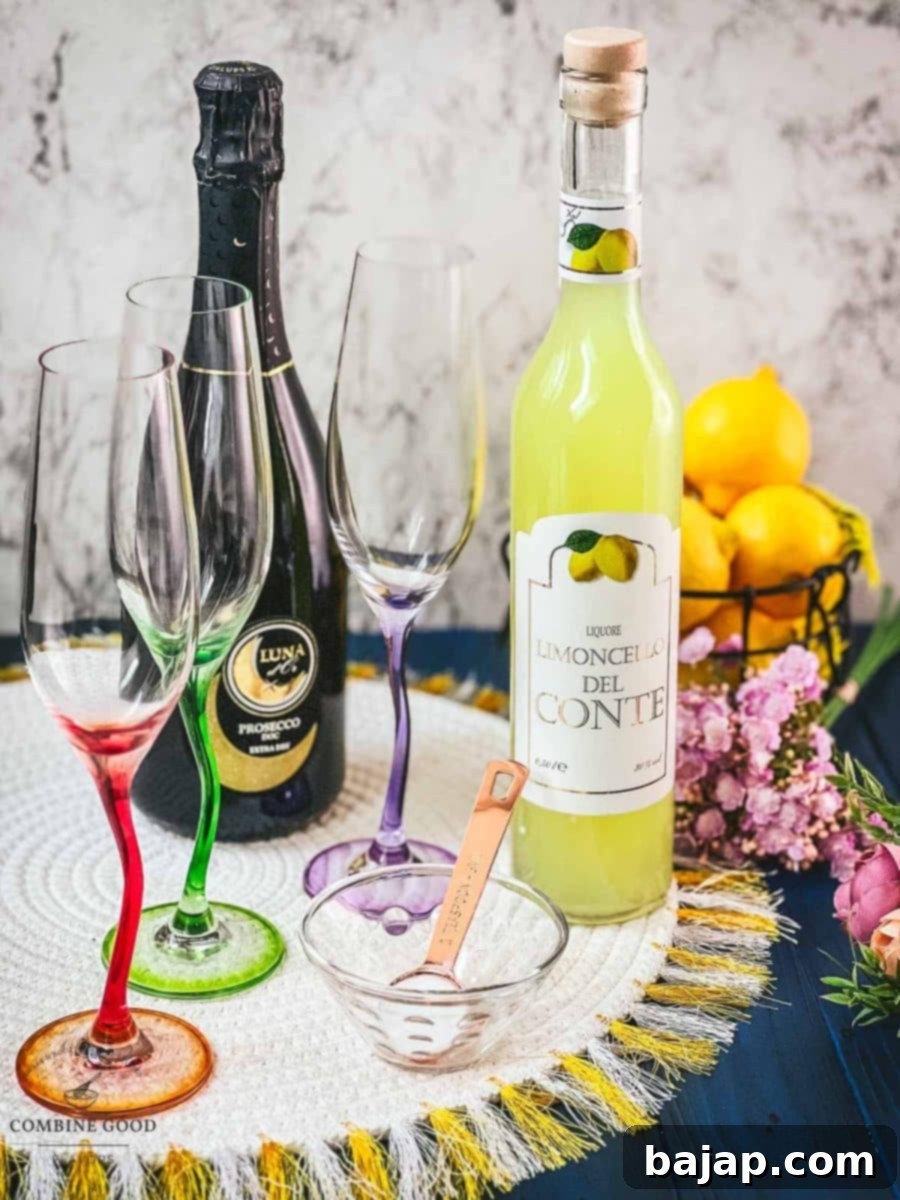 Sparkling limoncello ingredients laid out: a bottle of Prosecco, a bottle of Limoncello, and a bowl of granulated sugar.