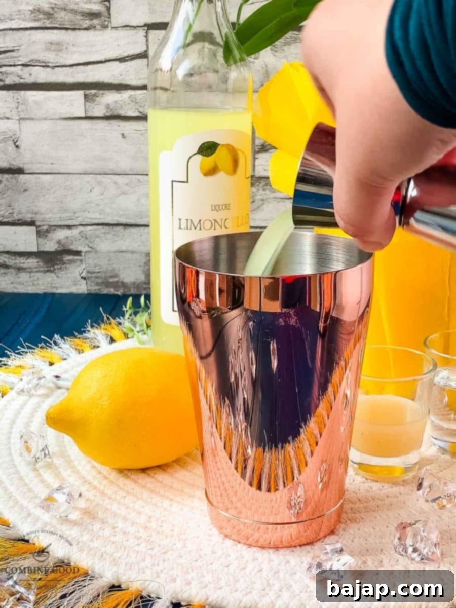 Add the limoncello to the smaller cocktail tin.