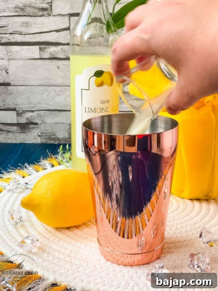 Add the lemon juice to the smaller cocktail tin.