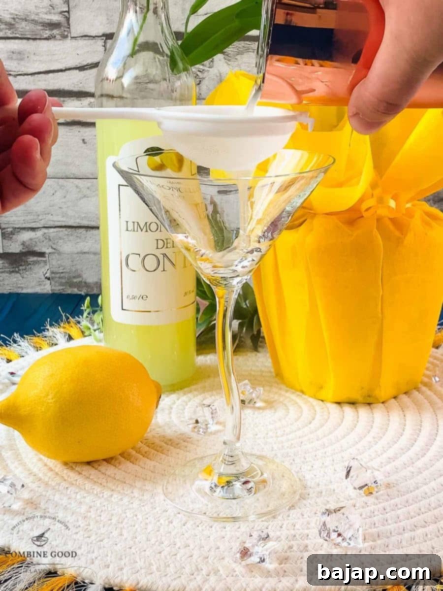 Fine strain the limoncello martini into your serving glass.