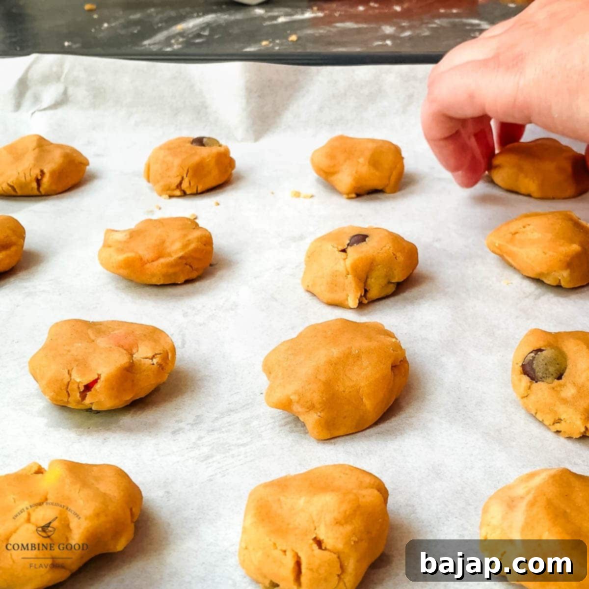 Place the peanut butter cookie dough ball on the baking sheet.