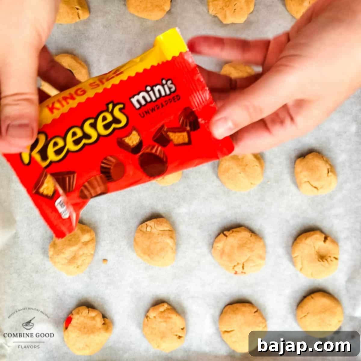 Hands holding the pack of Reese's peanut butter mini cups.