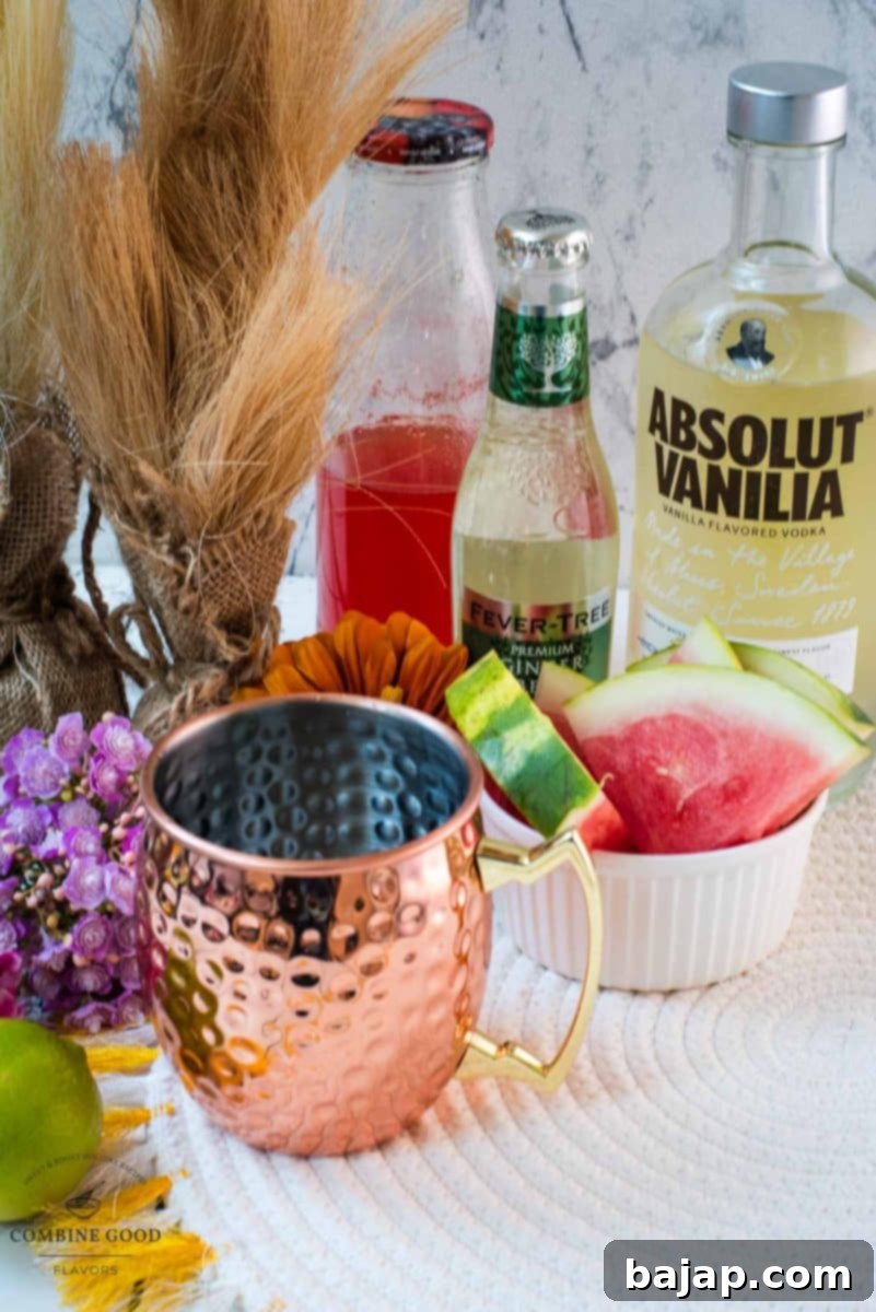 Key ingredients for a Watermelon Moscow Mule: homemade watermelon syrup, smooth vanilla vodka, zesty fresh lime juice, and spicy ginger beer.