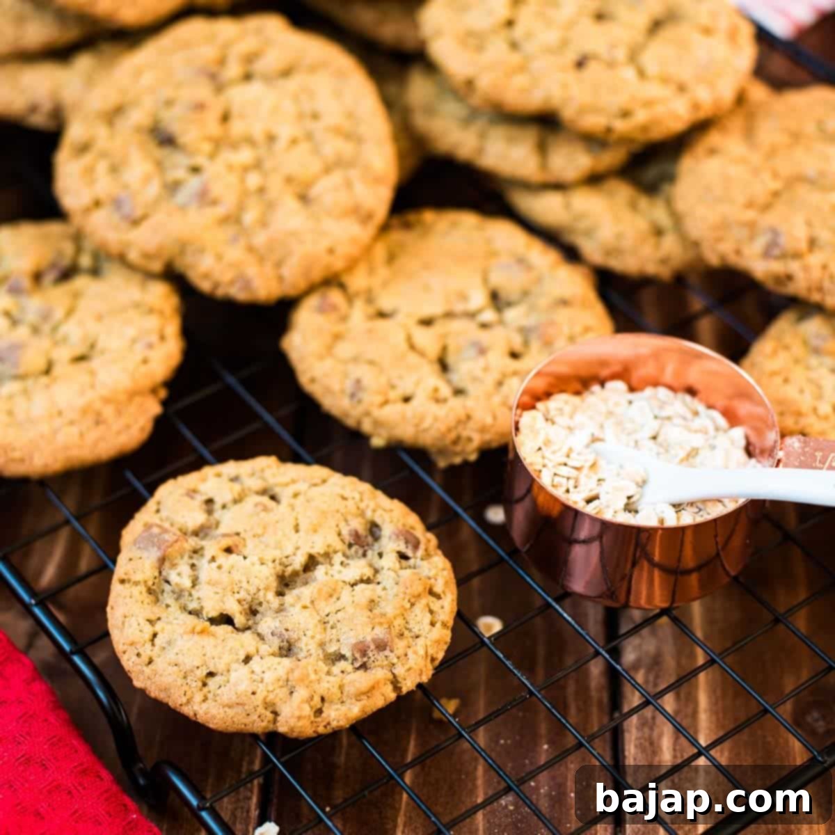 Chocolate chip oatmeal cookies placed on cooling rack.