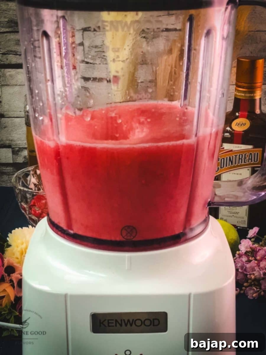 Raspberry Chill Margarita 9 Blending all ingredients together until the frozen raspberry margarita reaches a smooth, thick, and slushy consistency.