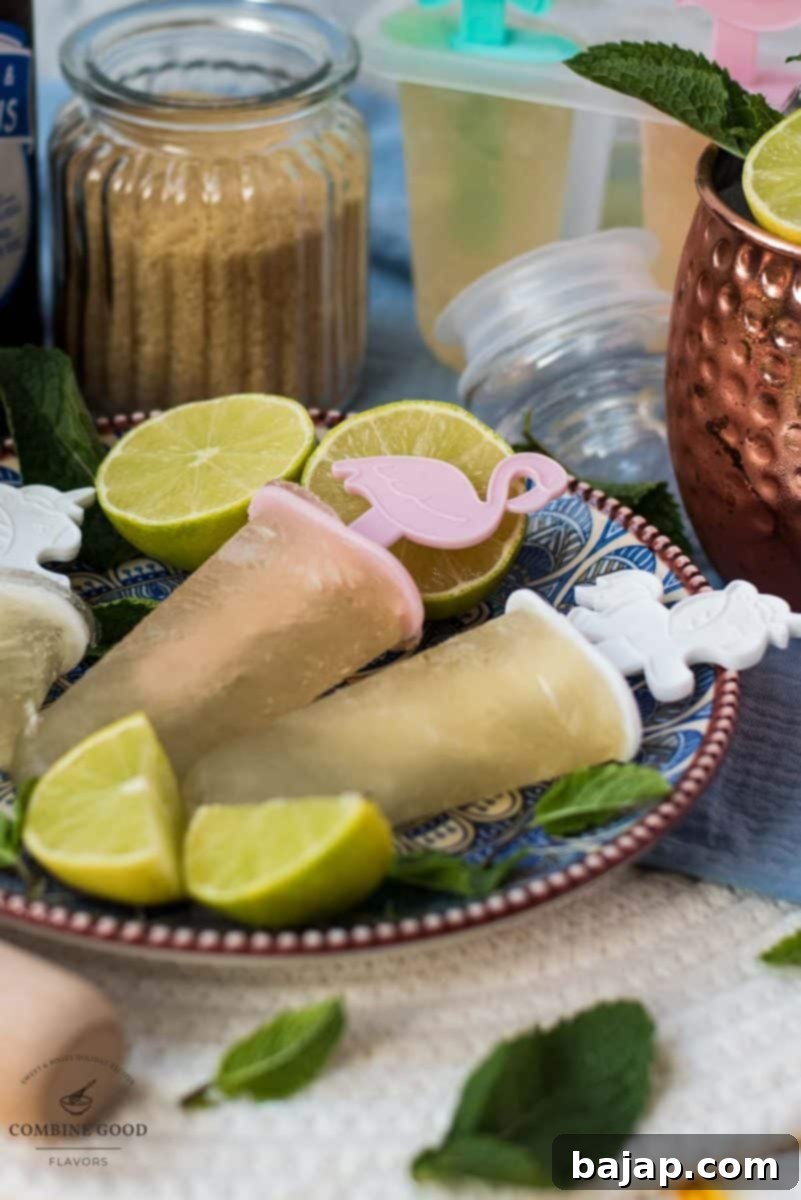 Gorgeous and refreshing Moscow mule popsicles placed on patterned plate.