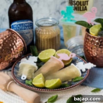 Gorgeous and refreshing Moscow mule popsicles placed on patterned plate.