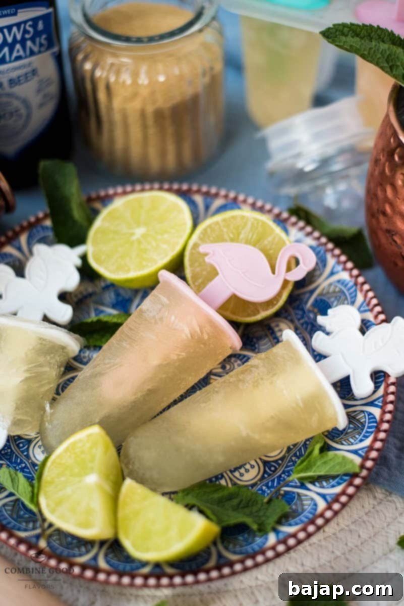 Gorgeous and refreshing Moscow mule popsicles placed on patterned plate.