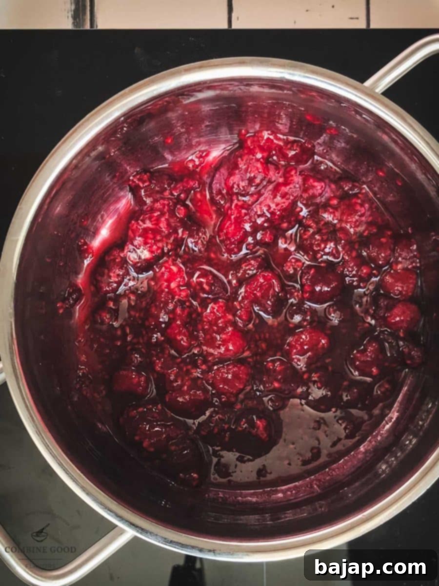 Sweet Raspberry Cheesecake Swirl 5 Raspberry sauce in a sauce pan.